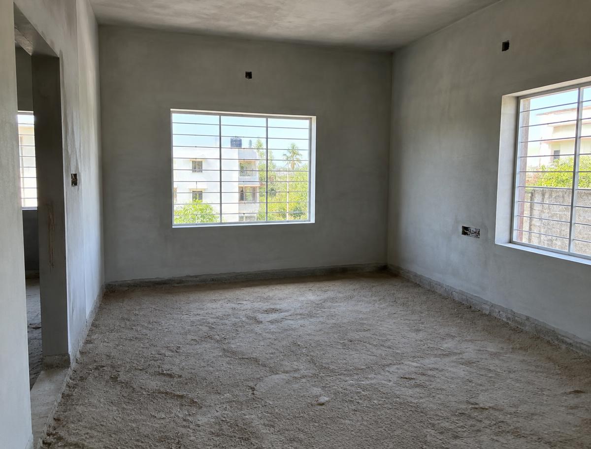 Newly plastered walls before flooring begins